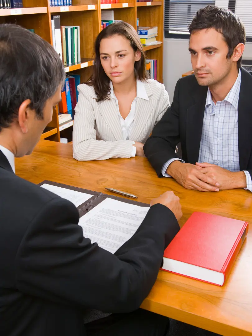Couple meeting with a collaborative divorce attorney in Rochester, NY to discuss a private divorce settlement.